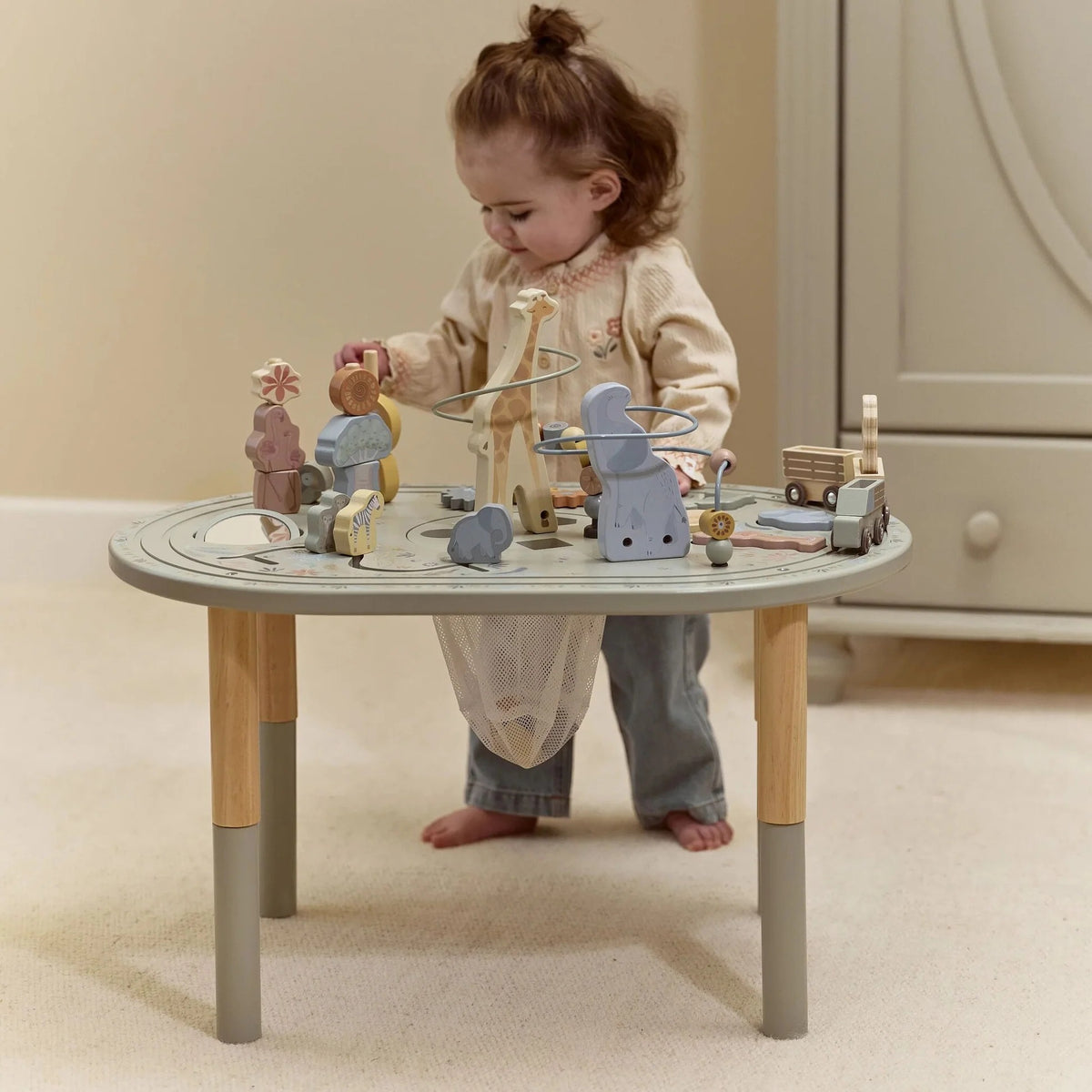 Child exploring the Little Dutch Safari Friends Activity Table XL