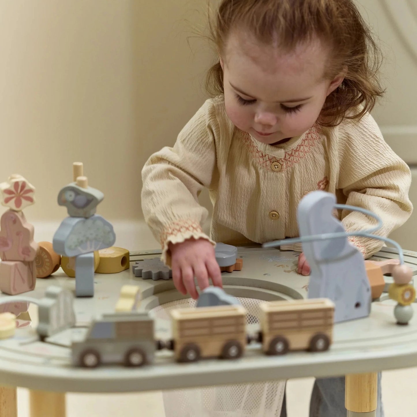 Child playing with the Little Dutch Safari Friends Activity Table XL