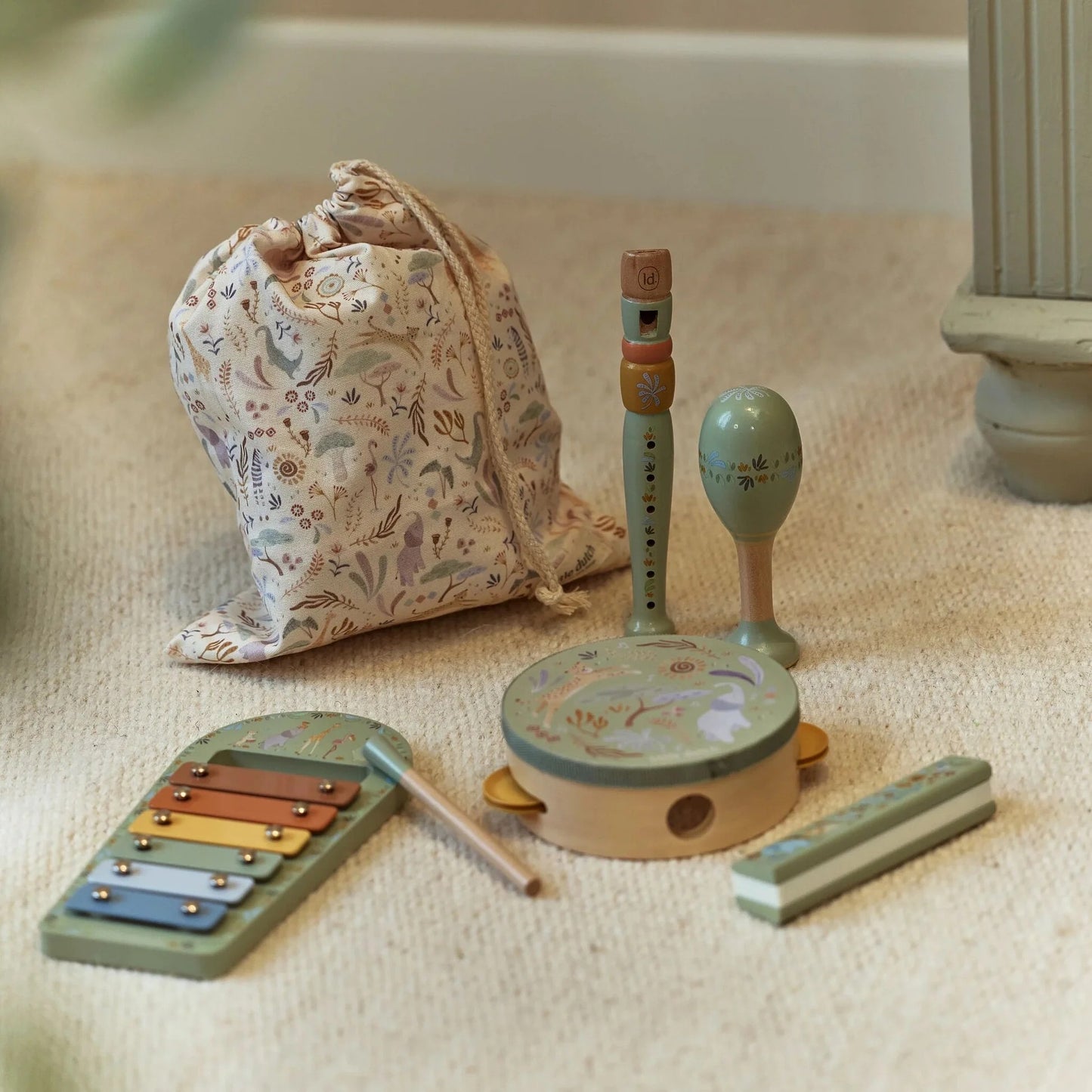 Little Dutch Safari Friends Music Set Green with instruments arranged beside the storage bag