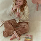 Child playing the recorder from the Little Dutch Safari Friends Music Set Pink
