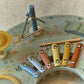 Close-up of percussion instruments on the Little Dutch Safari Friends Music Table
