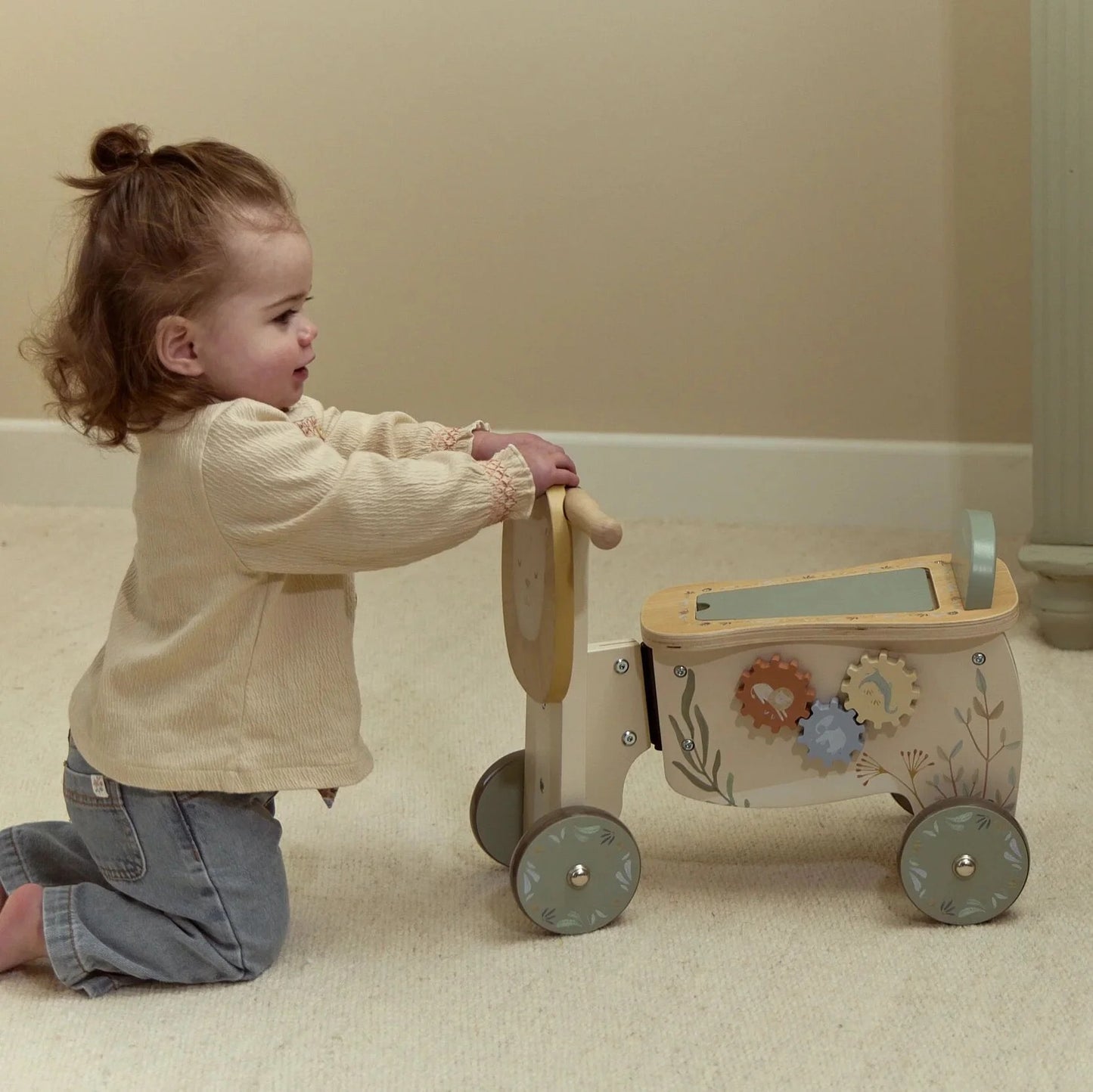 Child playing with the Little Dutch Safari Friends Ride-On Lion