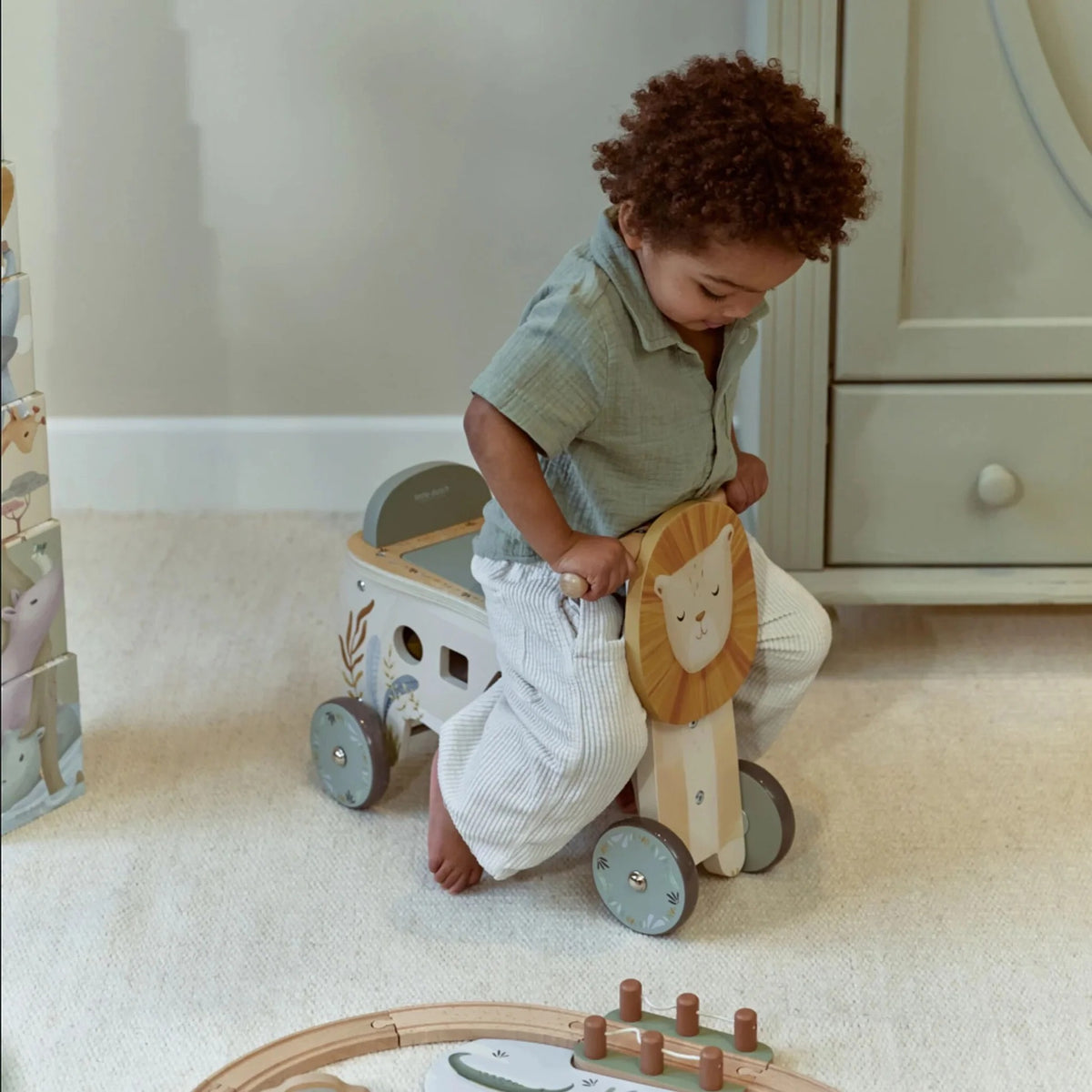 Child riding the Little Dutch Safari Friends Ride-On Lion