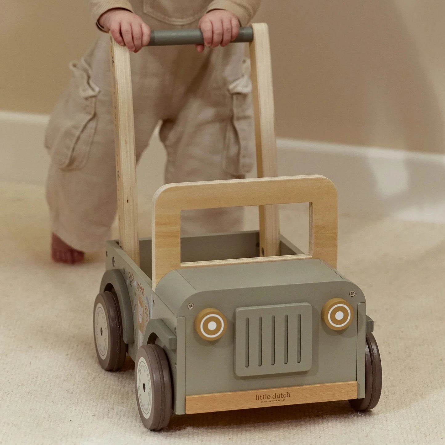 Child pushing the Little Dutch Safari Friends Wooden Safari Car