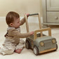 Child playing beside the Little Dutch Safari Friends Wooden Safari Car