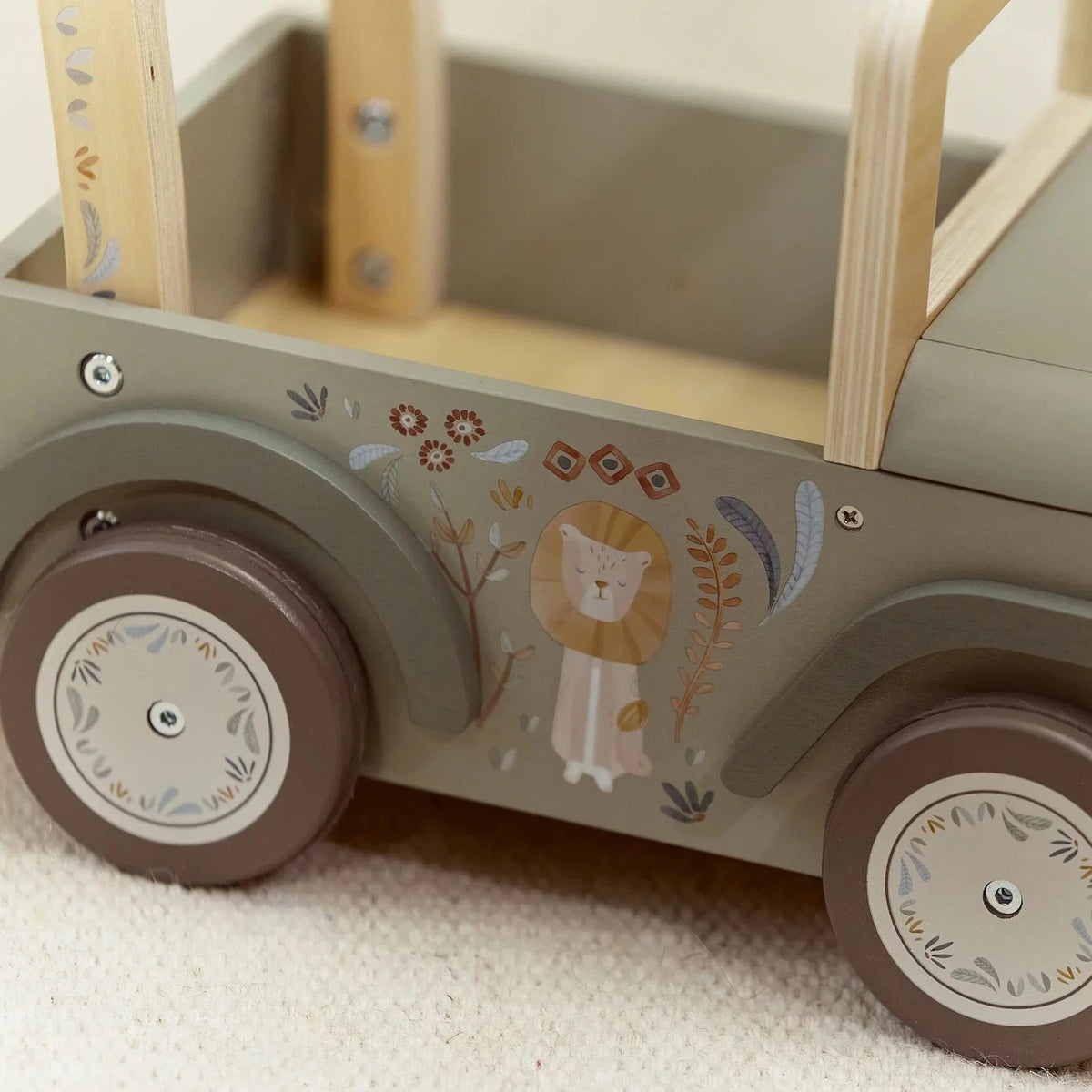 Close-up of Safari Friends lion artwork on the wooden safari car
